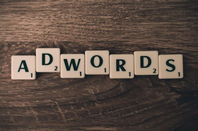 Scrabble forming adwords on a wooden surface